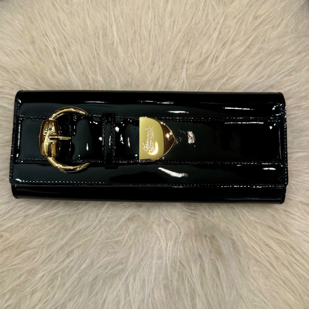 Gucci pattern leather clutch